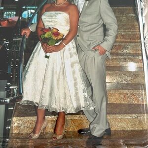 Beautiful feminine dress. Soft white with touch of light pink throughout.